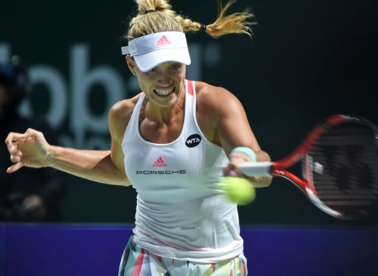 German's Angelique Kerber in action against Romania's Simona Halep during their match at the WTA Finals in Singapore, on October 25, 2016