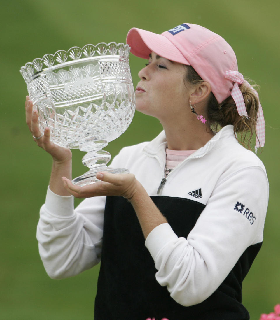 FILE - In this May 22, 2005, file photo, Paula Creamer kisses the trophy after winning the LPGA Sybase Classic in New Rochelle, N.Y. It was 15 years ago this week that Creamer won her first pro title, five days before her high school graduation. (AP Photo/Ed Betz, File)