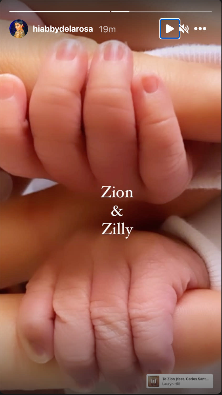 <p>De La Rosa also shared a photo of the babies' hands holding onto her fingers on her Instagram Stories, writing, "Zion & Zilly."</p> <p>The <a href="https://people.com/parents/nick-cannon-abby-de-la-rosa-welcome-twin-boys-zion-zillion/" rel="nofollow noopener" target="_blank" data-ylk="slk:new mom announced Cannon was her babies' father;elm:context_link;itc:0;sec:content-canvas" class="link ">new mom announced Cannon was her babies' father</a> on Instagram last April when she shared photos from a maternity shoot that featured the <a href="https://people.com/tv/the-masked-singer-revealed-so-far/" rel="nofollow noopener" target="_blank" data-ylk="slk:Masked Singer;elm:context_link;itc:0;sec:content-canvas" class="link "><em>Masked Singer</em></a> host.</p> <p>"Your Dad & I will always be here for you both; in complete unison and support. No matter what this world may throw your way, know that forgiveness is key and what is for you - is for YOU! You both are already so loved and we can't wait to meet you both," De La Rosa wrote at the time. That post has since been deleted from her Instagram page, but she regularly shares new shots of the adorable twins. </p>