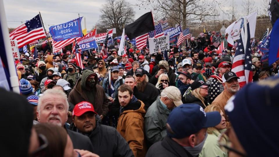 Supporters of then-President Donald Trump gather outside the U.S. Capitol building, which was eventually stormed, following a “Stop the Steal” rally on Jan. 6. Nearly one in five people facing charges in connection with the insurrection served in the U.S. military. (Photo by Spencer Platt/Getty Images)