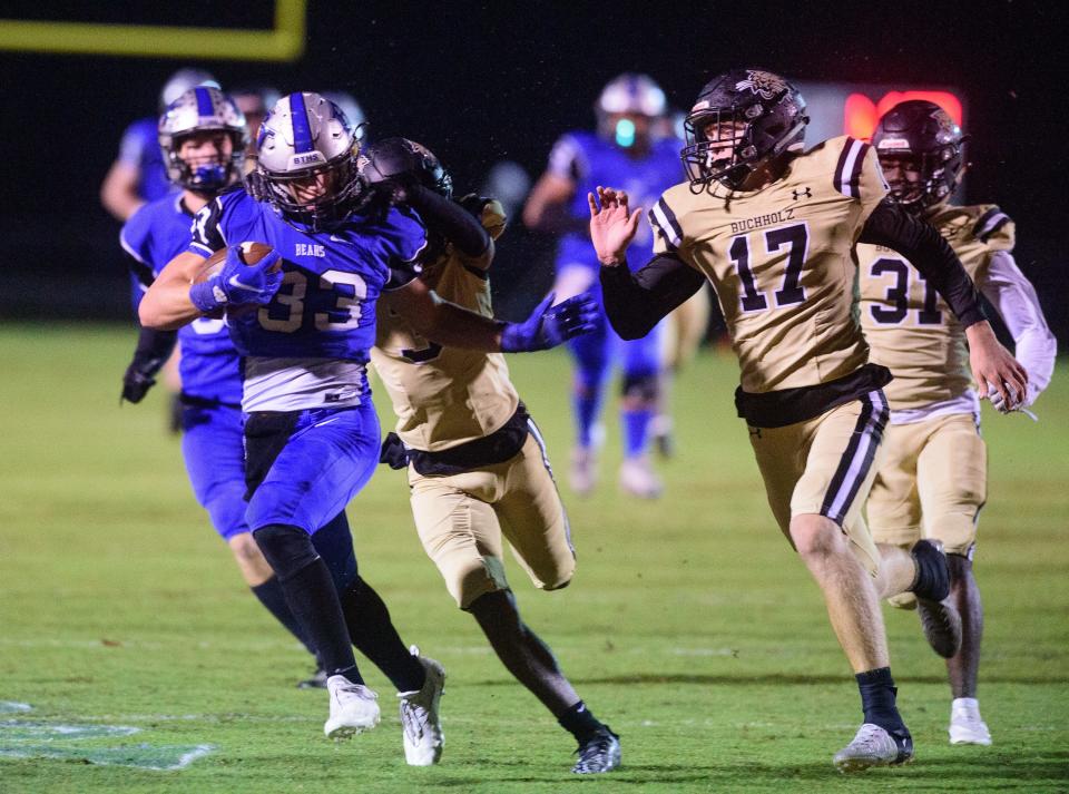 Bartram Trail running back Laython Biddle charges downfield against Gainesville Buchholz in the teams' 2021 game.