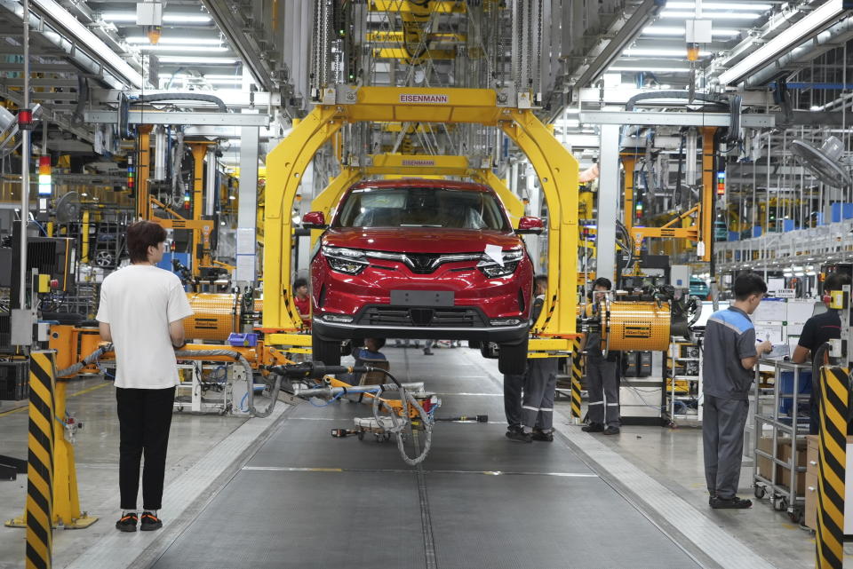 FILE - Workers assemble a car at a Vinfast factory in Hai Phong, Vietnam, on Sept. 29, 2023. Vietnamese automaker Vinfast agreed on Saturday, Jan. 8, 2024, to invest up to $2 billion into building an electric vehicle factory in southern India’s Tamil Nadu state.(AP Photo/Hau Dinh)