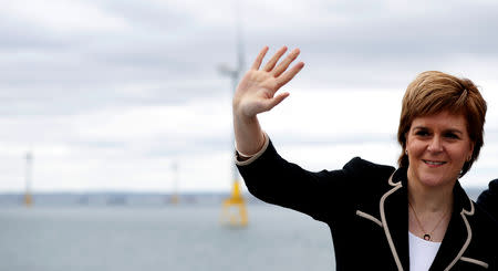 Scotland's first minister Nicola Sturgeon waves to workers at The European Offshore Wind Deployment Centre (EOWDC) sits off Aberdeen, Scotland, Britain, September 7, 2018. REUTERS/Russell Cheyne