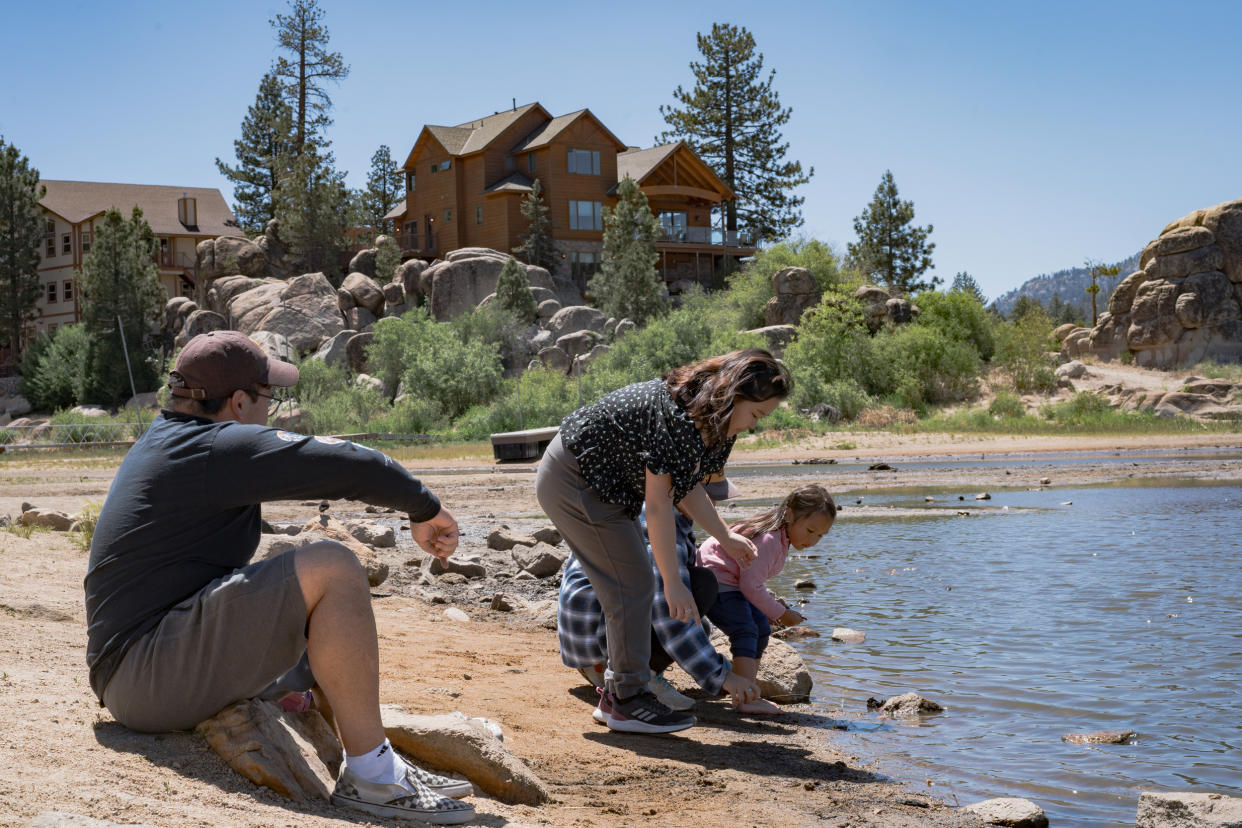 Image: Tourists play on the shores of  Big Bear Lake at Boulder Bay Park on  June 19, 2022. (Gabriella Angotti-Jones for NBC News)