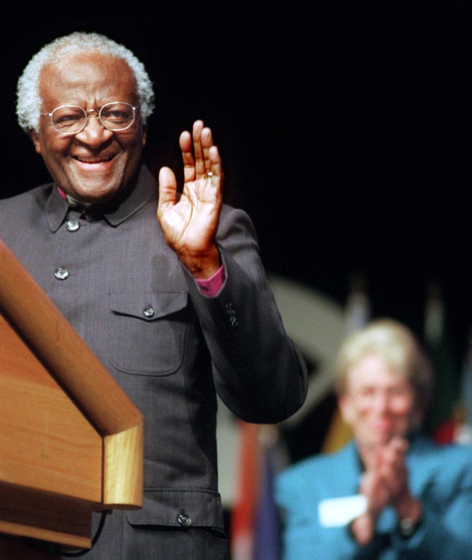 The late Archbishop Desmond Tutu gets a warm welcome in 1999 during the Presidential Lecture Series at the University of North Florida including by UNF President Anne Hopkins in the background.