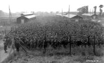 German prisoners of war captured after the D-Day landings in Normandy are guarded by U.S. troops at a camp in Nonant-le-Pin, France, on Aug. 21, 1944. (Photo: U.S. National Archives/handout via Reuters)