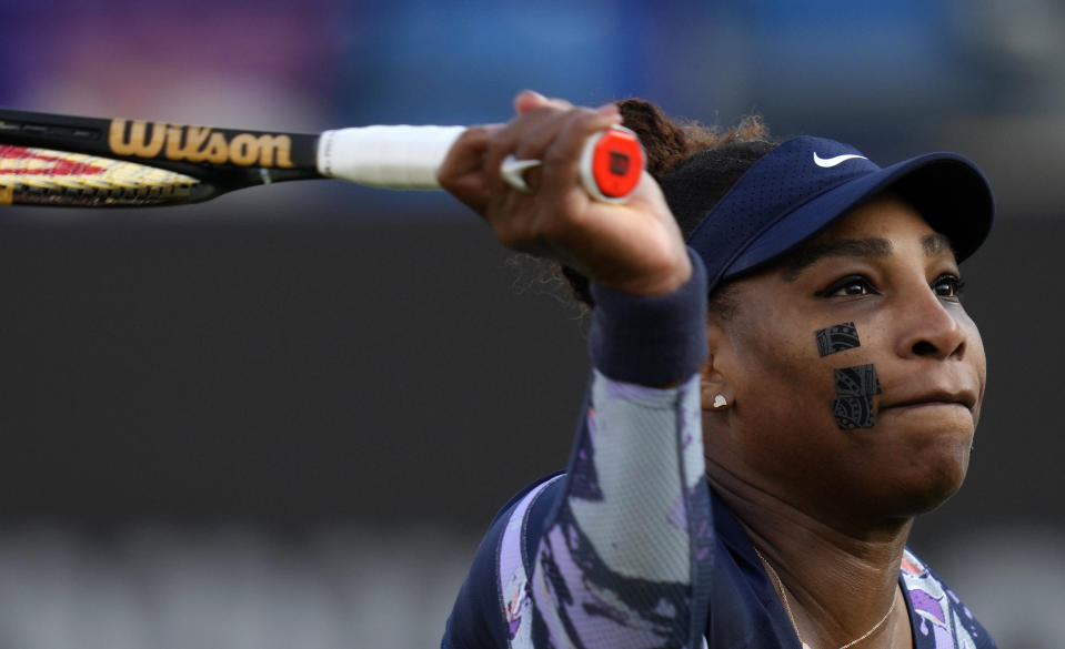 Serena Williams of the United States returns the ball during their doubles tennis match with Ons Jabeur of Tunisia against Marie Bouzkova of Czech Republic and Sara Sorribes Tormo of Spain at the Eastbourne International tennis tournament in Eastbourne, England, Tuesday, June 21, 2022. (AP Photo/Kirsty Wigglesworth)