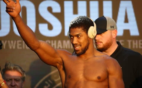 Anthony Joshua during a weigh-in ceremony on the eve of his bout against American boxer Andy Ruiz Jr - Credit: Valery Sharifulin\\TASS via Getty Images