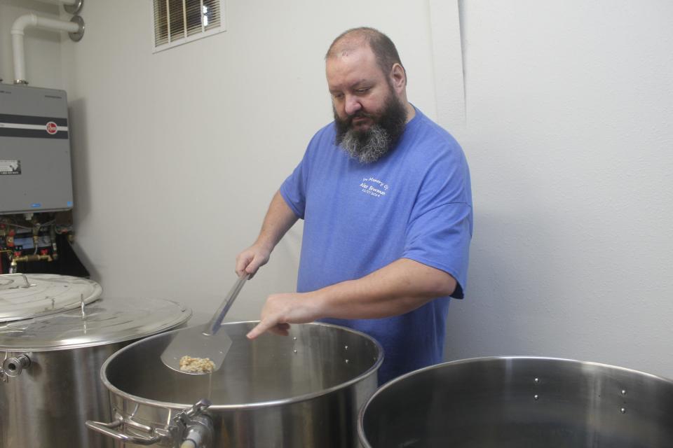 Brother Sebastian Richey points to the base grain and oatmeal for his stout.