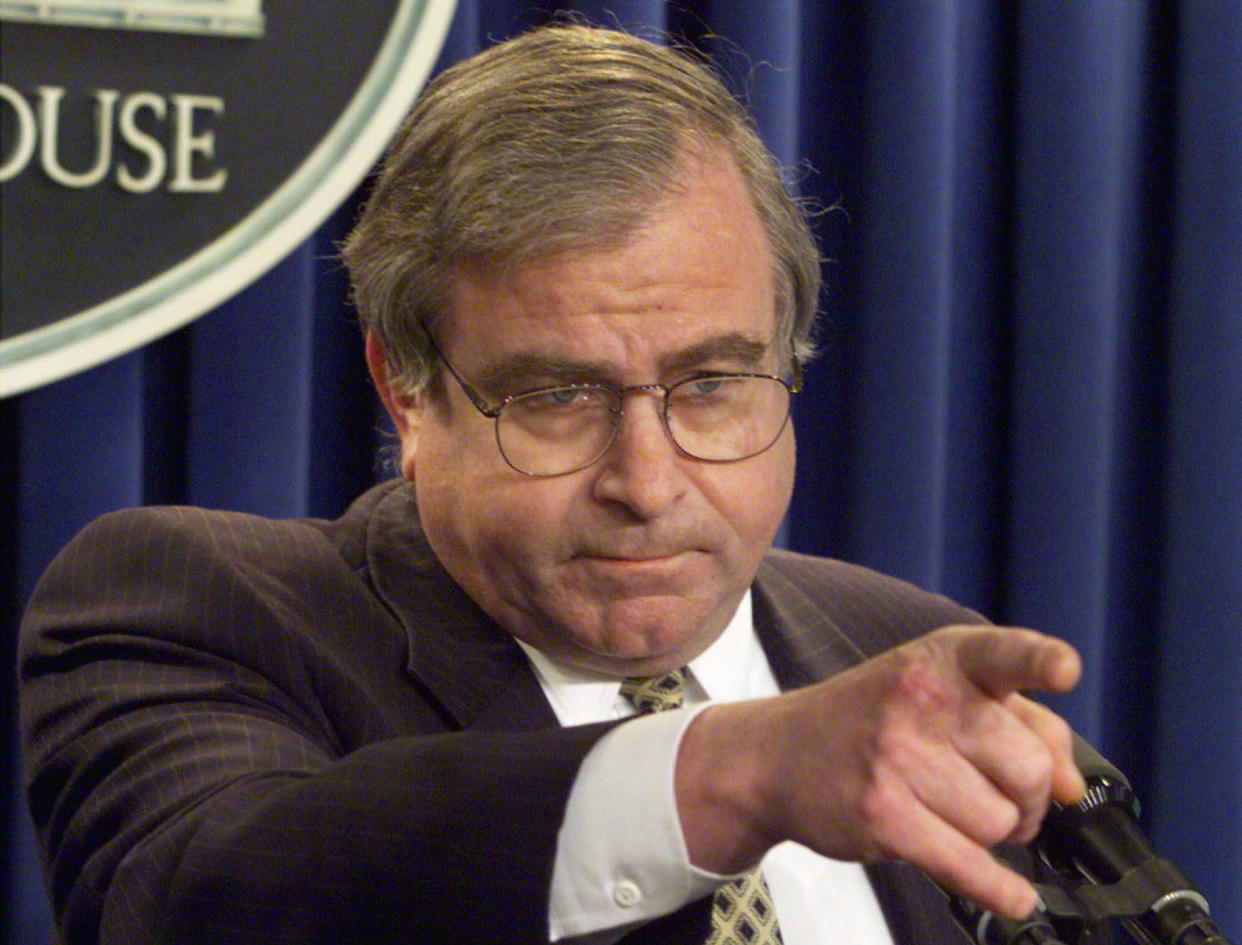 Sandy Berger points to a member of the media to elicit a question.