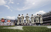 FILE - In this July 17, 2010 file photo, former New York Yankees players, left to right, Don Johnson, Hank Workman, Duane Pillette, Charlie Silvera, Jerry Coleman, and Whitey Ford, stand on the field during Old-Timers' Day ceremonies at Yankee Stadium in New York. A family member tells The Associated Press on Friday, Oct. 9, 2020 that Ford died at his Long Island home Thursday night. (AP Photo/Frank Franklin, File)