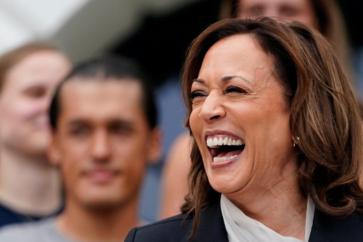 U.S. Vice President Kamala Harris laughs as she delivers remarks to the women and men's National Collegiate Athletic Association (NCAA) Champion teams on the South Lawn of the White House, Washington, D.C. on July 22, 2024.