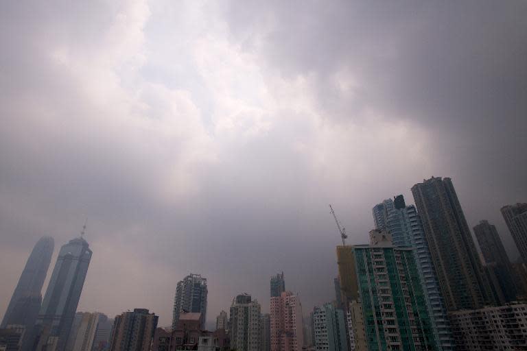 The sun breaks through the clouds over Hong Kong on September 23, 2013 as Typhoon Usagi moves out of the territory