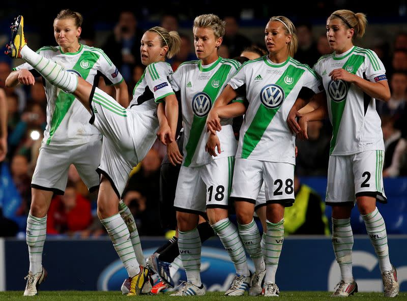 FILE PHOTO: Wolfsburg's Zsanett Jakabfi (2nd L) reacts in the wall during their women's UEFA Champions League final against Olympique Lyon in London.