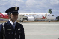 A plane carrying the Olympic flame arrives before Olympic Flame Arrival Ceremony at Japan Air Self-Defense Force Matsushima Base in Higashimatsushima in Miyagi Prefecture, north of Tokyo, Friday, March 20, 2020. The Olympic flame from Greece is set to arrive in Japan even as the opening of the the Tokyo Games in four months is in doubt with more voices suggesting the games should to be postponed or canceled because of the worldwide virus pandemic. (AP Photo/Eugene Hoshiko)