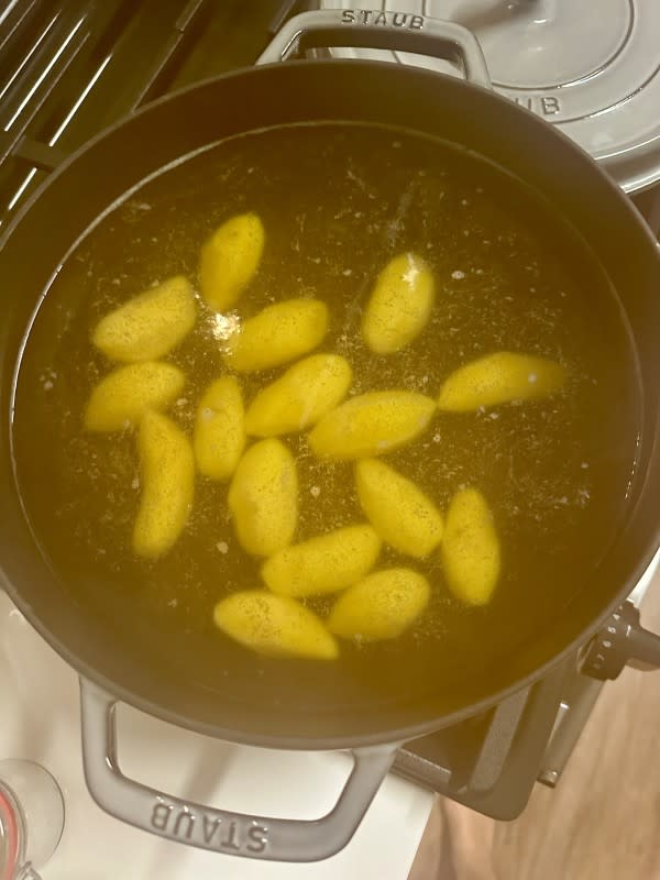 Potatoes slowly simmering in salted cold water<p>Kelli Venner</p>