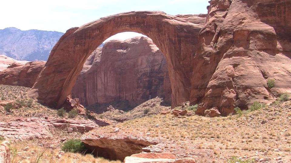 A flash flood in 2013 wiped out part of a trail to Rainbow Bridge National Monument. A temporary dock is currently being used to get visitors to the site. The National Park Service is looking to redesign the trail. | John Hollenhorst, Deseret News