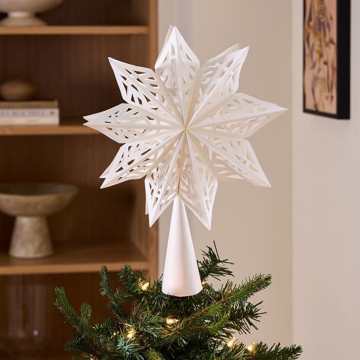 <p><a href="https://go.redirectingat.com?id=74968X1596630&url=https%3A%2F%2Fwww.westelm.com%2Fproducts%2Flight-up-snowflake-paper-tree-topper-d16824&sref=https%3A%2F%2Fwww.housebeautiful.com%2Fentertaining%2Fholidays-celebrations%2Fg45735039%2Fchristmas-tree-topper-ideas%2F" rel="nofollow noopener" target="_blank" data-ylk="slk:Shop Now;elm:context_link;itc:0;sec:content-canvas" class="link rapid-noclick-resp">Shop Now</a></p><p>Snowflake Paper Tree Topper</p><p>westelm.com</p><p>$25.00</p>