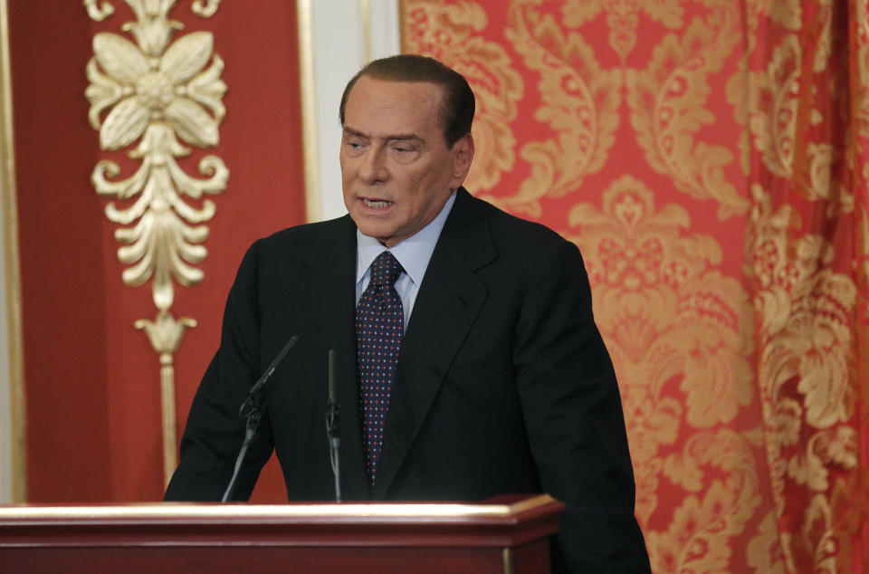 Former Italian Premier Silvio Berlusconi talks during a press conference in Gerno, near Milan, Saturday, Oct. 27, 2012. Silvio Berlusconi, who announced this week he wouldn't run in spring elections, pulled an about-face Saturday and said he felt compelled to stay in politics to reform Italy's justice system after being convicted of tax fraud. (AP Photo/Luca Bruno)