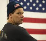 A worker from the Philadelphia Energy Solutions refinery owned by the Carlyle Group in south Philadelphia listens to United Steelworkers representatives during a union meeting in Norwood, Pennsylvania March 20, 2014. REUTERS/David M. Parrott