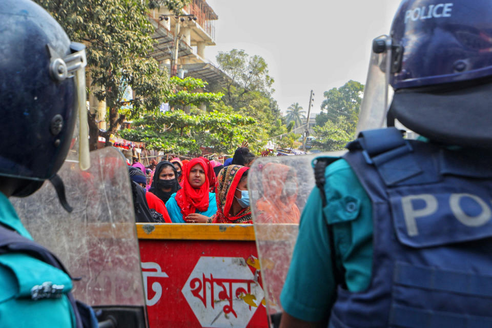 Garment workers block a key intersection as they protest in Dhaka on November 12, 2023, demanding a near-tripling of the minimum wage to 23,000 taka ($208). Hundreds of Bangladeshi garment workers rallied November 12 demanding fair wages after dismissing a pay offer as too small, as the death toll from the violent protests that erupted last month rose to four. (Photo by Abdul Goni / AFP) (Photo by ABDUL GONI/AFP via Getty Images)
