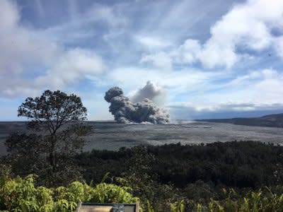 A rising ash plume from Halema'uma'u, a crater at the summit of Kilauea, is seen from the caldera rim near Volcano House in Hawaii, U.S. May 24, 2018.   Picture taken May 24, 2018.    USGS/Handout via REUTERS