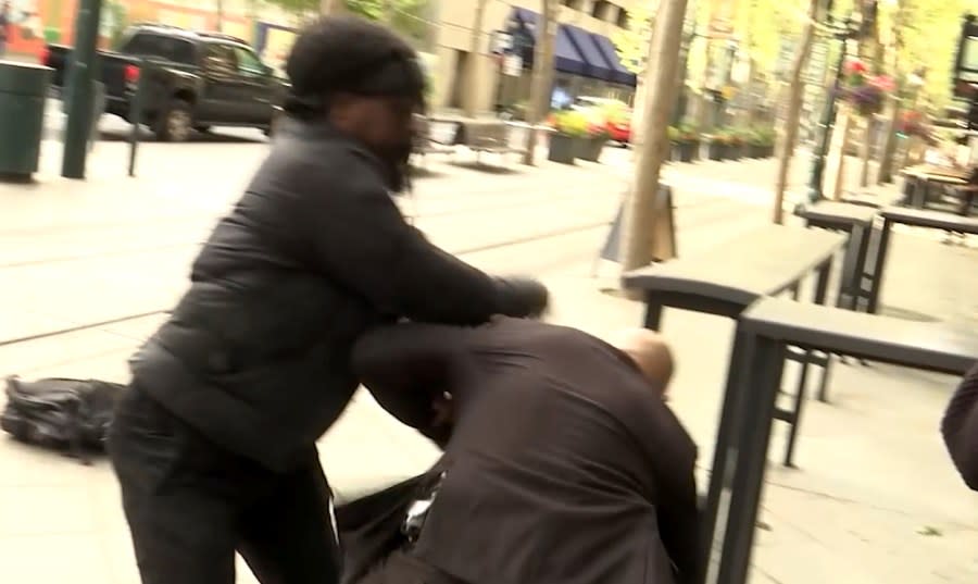 A man punches an SJPD officer who was guarding the mayor on April 23, 2024. (KRON4 Photo)