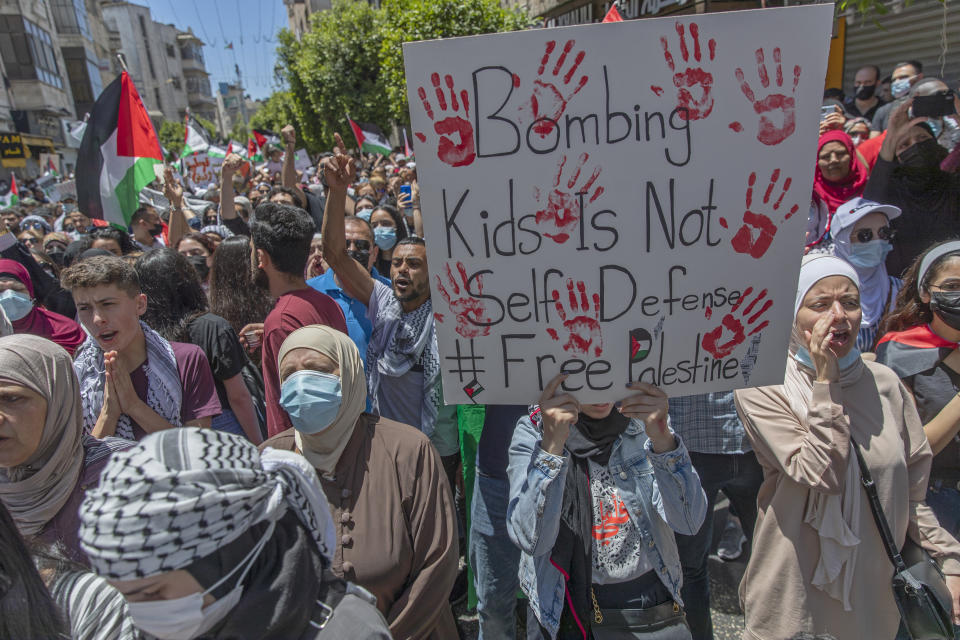 Palestinians chant slogans while while taking part in an anti-Israel demonstration during a general strike in the West Bank city of Ramallah, Tuesday, May 18, 2021. Palestinians across Israel and the occupied territories are on strike in a rare collective action against Israel’s policies as the war, now in its second week, showed no signs of abating. (AP Photo/Nasser Nasser)