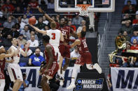 Belmont's Dylan Windler (3) shoots against Temple's Ernest Aflakpui (24) during the second half of a First Four game of the NCAA college basketball tournament, Tuesday, March 19, 2019, in Dayton, Ohio. (AP Photo/John Minchillo)