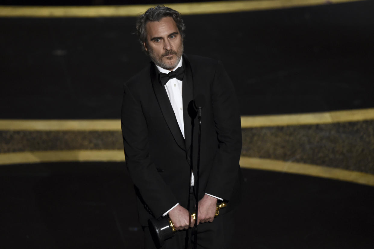 Joaquin Phoenix accepts the award for best performance by an actor in a leading role for "Joker" at the Oscars on Sunday, Feb. 9, 2020, at the Dolby Theatre in Los Angeles. (AP Photo/Chris Pizzello)