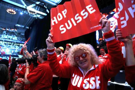 Switzerland fans cheer on their team during the Davis Cup final singles tennis match at the Pierre-Mauroy stadium in Villeneuve d'Ascq, near Lille, November 21, 2014. REUTERS/Pascal Rossignol