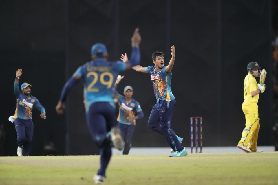 Sri Lanka's Maheesh Theekshana, second right, celebrates the wicket of Australia's Josh Inglis during the fifth one-day international cricket match between Australia and Sri Lanka in Colombo, Sri Lanka, Friday, June 24, 2022. (AP Photo/Eranga Jayawardena)