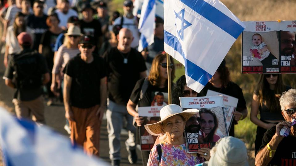 PHOTO: Family members, relatives and supporters hold posters showing hostages as they march to Jerusalem, Nov. 15, 2023 in Beit Hashmonai, Israel. (Amir Levy/Getty Images)