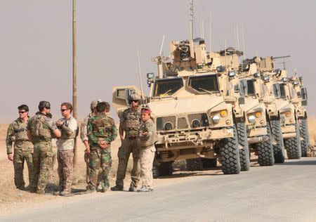 U.S. military vehicles are seen in Nawaran north of Mosul during an operation to attack Islamic State militants, Iraq October 26, 2016. REUTERS/Ari Jalal