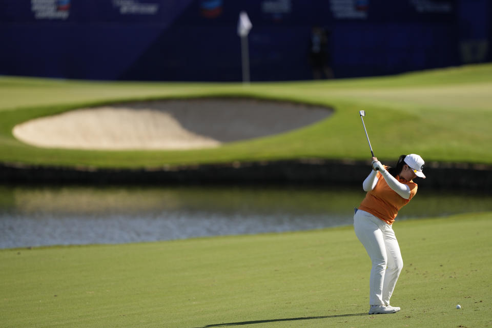 Angel Yin hits from the fairway on the 18th hole during the third round of the Chevron Championship women's golf tournament at The Club at Carlton Woods on Saturday, April 22, 2023, in The Woodlands, Texas. (AP Photo/David J. Phillip)