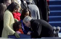 <p>President George W. Bush greets Sasha Obama at the inauguration of Barack Obama as the 44th President of the United States of America on January 20, 2009 in Washington, DC.</p>