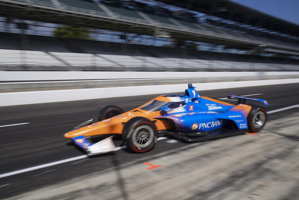 Scott Dixon, of New Zealand, leaves the pits during a practice session for the Indianapolis 500 auto race at Indianapolis Motor Speedway, Thursday, Aug. 13, 2020, in Indianapolis. (AP Photo/Darron Cummings)