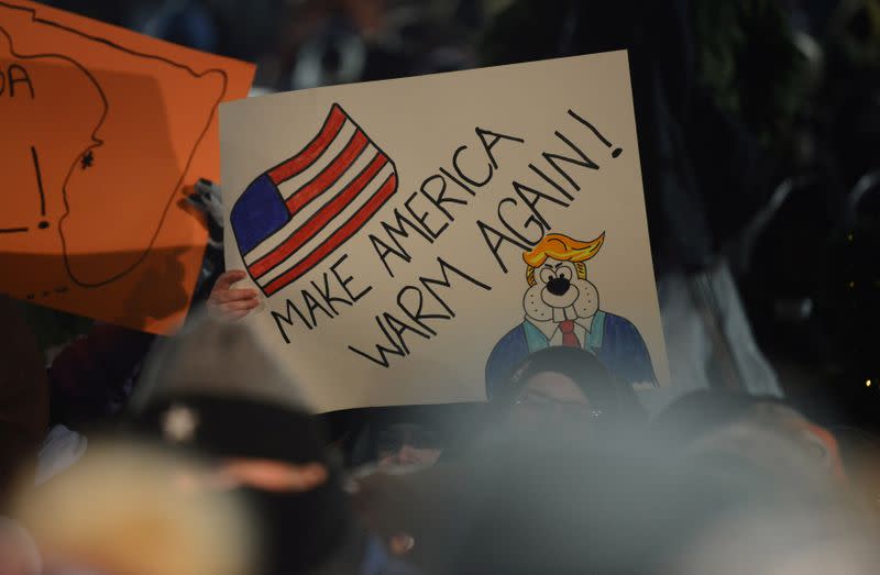 Fan of Punxsutawney Phil displays a sign on Groundhog Day in Punxsutawney