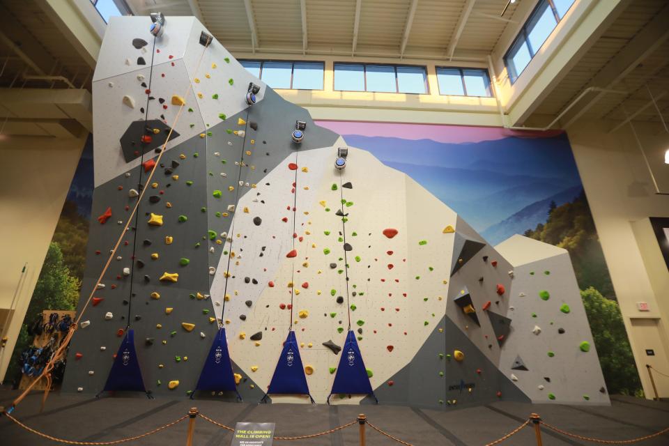 A climbing wall is part of the Public Lands store open at Polaris.