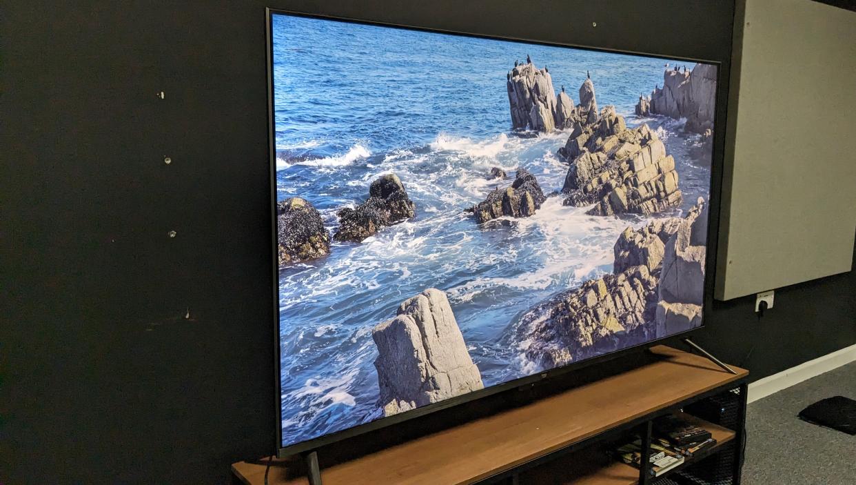  Amazon Omni QLED showing waves and rocks on screen . 