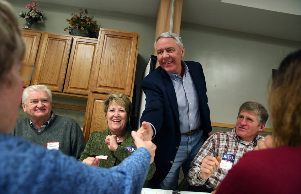 In this Jan. 24, 2014 photo, Weld County District Attorney Ken Buck, seen as the front-runner in the GOP primary for the upcoming U.S. Senate race, shakes hands with supporter Arlene Burnham during a campaign dinner event at Johnson's Corner, a truck stop and diner in Johnstown, Colo. Buck narrowly lost a 2010 Senate bid after being hammered for statements that angered some women and gays. Now his candidacy will be a test of whether a tea party favorite can do better in 2014. (AP Photo/Brennan Linsley)