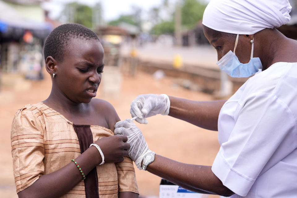 A health worker administers a cervical cancer vaccine HPV Gardasil to a girl on the street in Ibadan, Nigeria, on May 27, 2024. African countries have some of the world's highest rates of cervical cancer. Growing efforts to vaccinate more young girls for the human papillomavirus are challenged by the kind of vaccine hesitancy seen for some other diseases. Misinformation can include mistaken rumors that girls won't be able to have children in the future. Some religious communities must be told that the vaccine is "not ungodly." More than half of Africa's 54 nations – 28 – have introduced the vaccine in their immunization programs, but only five have reached the 90% coverage that the continent hopes to achieve by 2030. (AP Photo/Sunday Alamba)