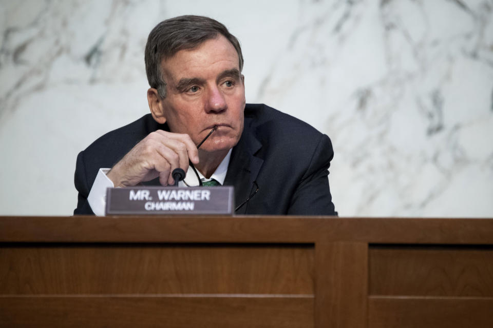 FILE - In this April 14, 2021, file photo Sen. Mark Warner, D-Va., listens during a Senate Select Committee on Intelligence hearing about worldwide threats, on Capitol Hill in Washington. Democratic-led congressional committees are vowing to press President Joe Biden’s administration on what went wrong as the Taliban swept to power in Afghanistan, leaving scores of Americans and the thousands who helped them over the years in grave danger and supplying insurgents with a massive cache of U.S. weaponry. Warner, chairman of the Senate Intelligence Committee, said he would work with other committees to ask tough questions about “why we weren’t better prepared for a worst-case scenario." (Saul Loeb/Pool via AP, File)