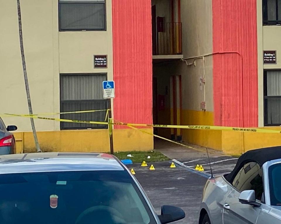 Evidence markers are scattered on the pavement of an apartment complex at Southwest 216th Street and 109th Avenue in Goulds Tuesday, Nov. 17, 2020. Miami-Dade County police were investigating a shooting incident on the property.