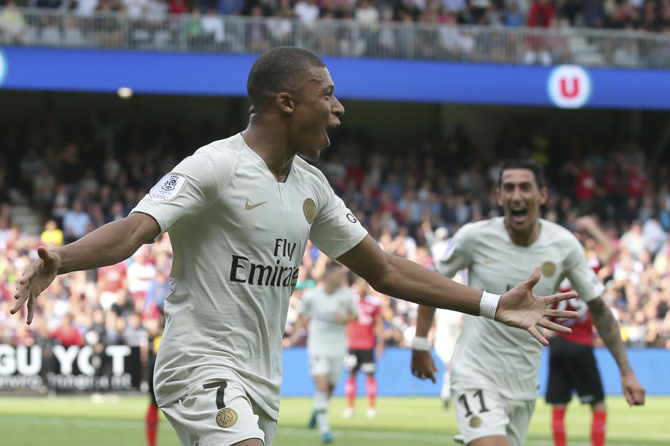 PSG's Kylian Mbappe celebrates after scoring the second goal for his team during their League One soccer match between Guingamp and Paris Saint Germain at Roudourou stadium in Guingamp, western France, Saturday, Aug. 18, 2018. (AP Photo)