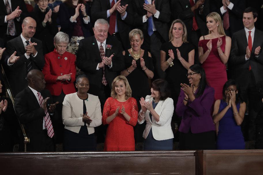 Denisha Merriweather, second from left, is applauded while being acknowledged by President Donald Trump during his address to a joint session of Congress on Capitol Hill in Washington, Tuesday, Feb. 28, 2017. (AP Photo/J. Scott Applewhite)