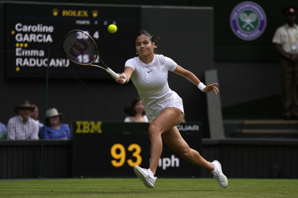 Britain's Emma Raducanu returns the ball to France's Caroline Garcia during their singles tennis match against on day three of the Wimbledon tennis championships in London, Wednesday, June 29, 2022. (AP Photo/Alastair Grant)