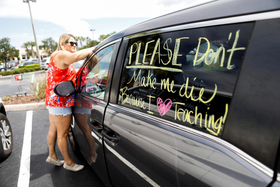 Florida teachers, whose unions are against their members returning to work, held a car parade protest in front of the Pasco County School District office in Land O' Lakes, Florida on July 21.  (Photo: Octavio Jones / Feuters)