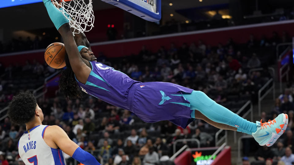 Charlotte Hornets Montrezl Harrell (7) dunks on Detroit Pistons guard Killian Hayes (7) in the first half of an NBA basketball game in Detroit, Friday, Feb. 11, 2022. (AP Photo/Paul Sancya)