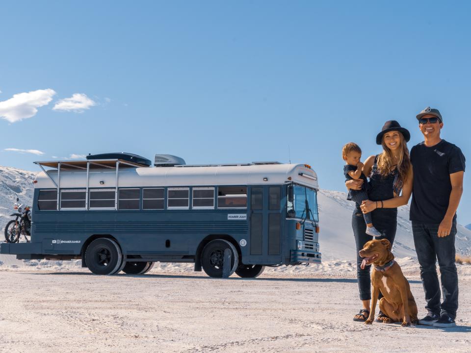 The family standing outside their Number Juan Bus